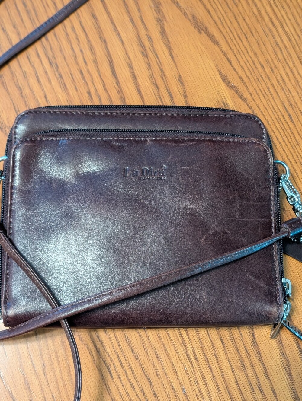 La Diva Leather Crossbody Bag in Dark Brown.